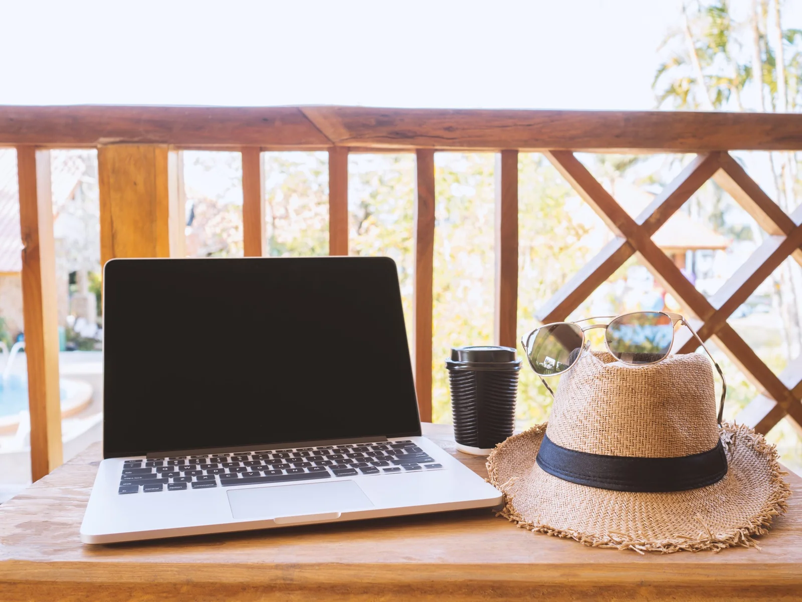a-laptop-coffee-mug-hat-and-eyeglasses-sit-on-a-2025-02-11-15-53-31-utc-scaled